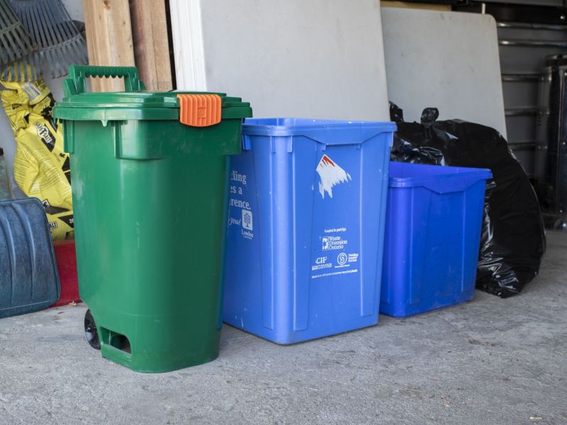 A small size Green Bin in a garage
